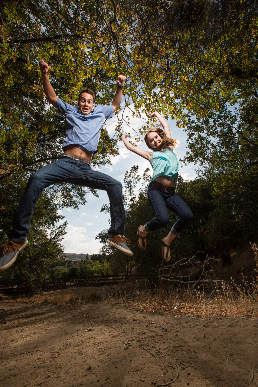 boy and girl jumping in the air