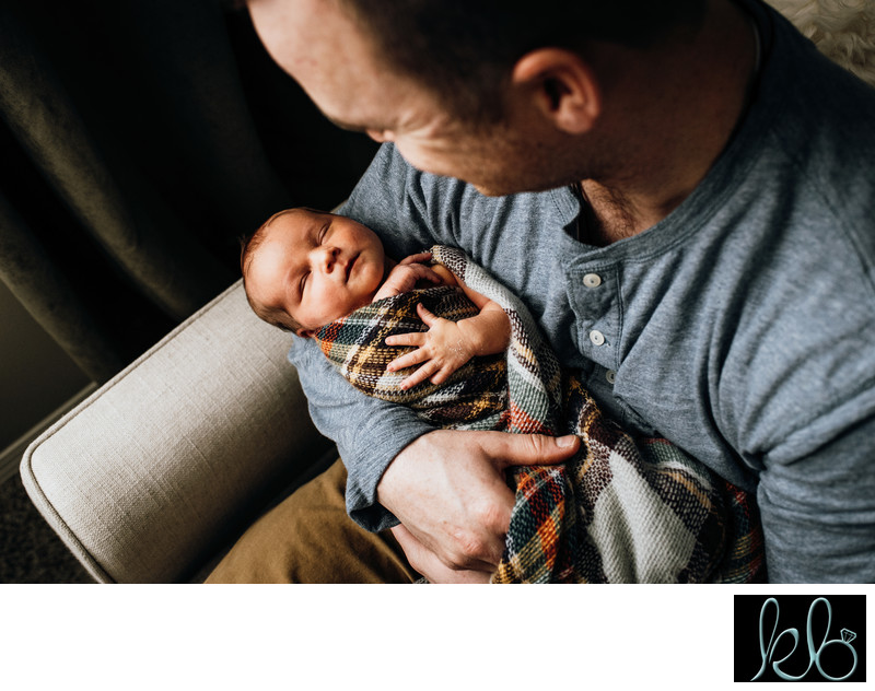 Father Holding Newborn Baby
