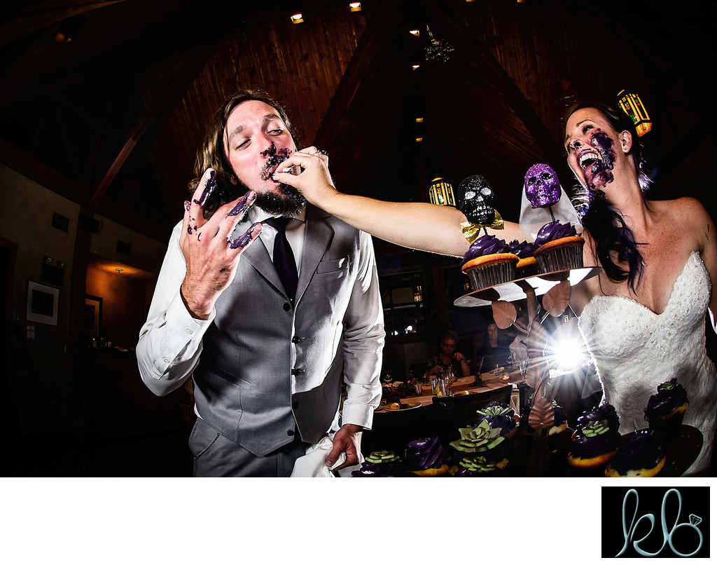 Bride and Groom Have Fun Cutting their Cake
