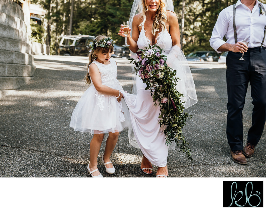 Flower Girl Helping Her Mom With Her Dress