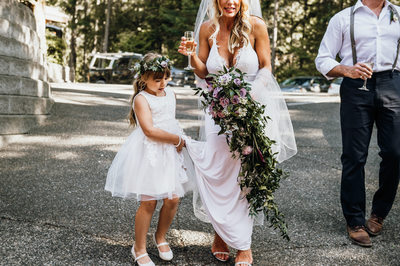 Flower Girl Helping Her Mom With Her Dress
