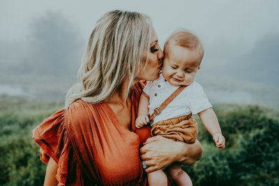 Mom Kissing Her Baby Boy at Sunrise Photo Shoot