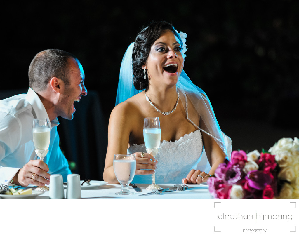 bride stunned groom laughing