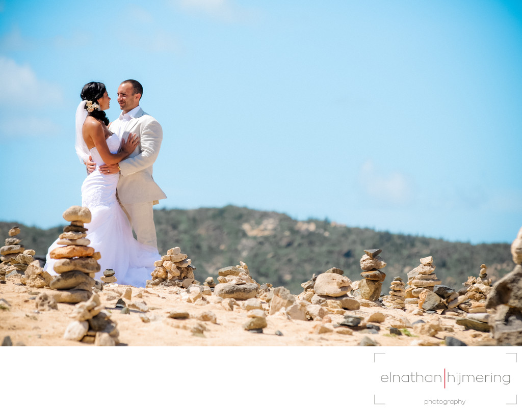 bride and groom stacked rocks in aruba
