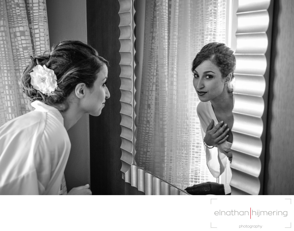 bride peeking in mirror