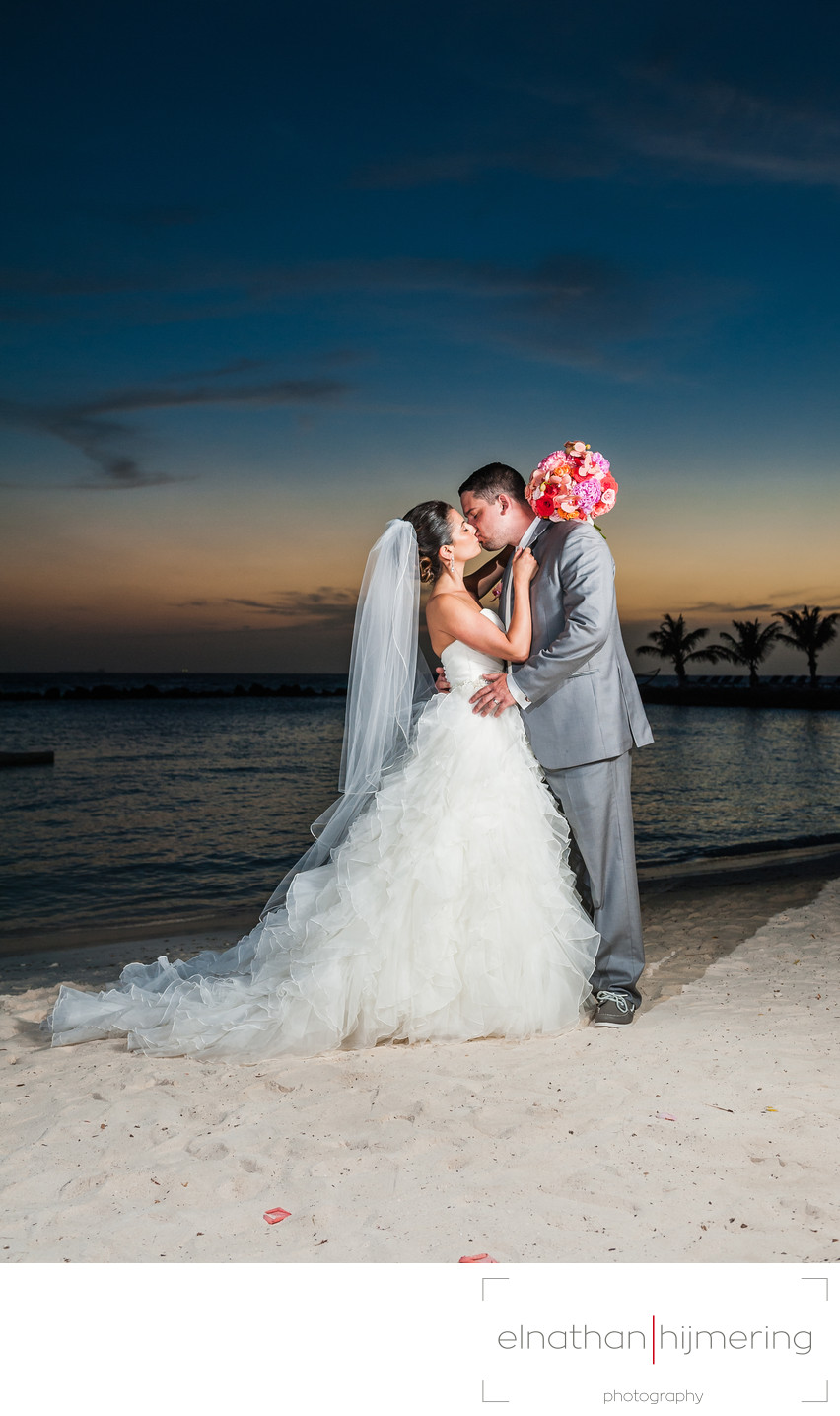 kissing couple on beach sunset