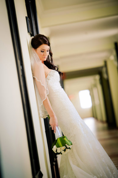bride posing with flowers
