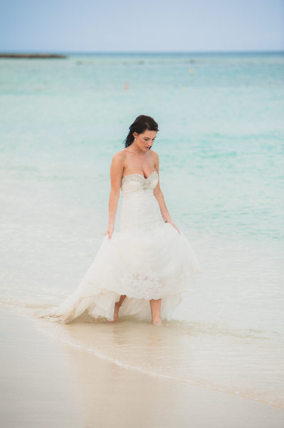 bride walking in water trash the dress