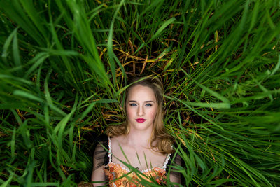 Laying In Tall Grass Senior Portrait