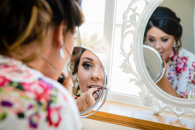 Bride Applies Lipstick Wedding Belles on the Bluff