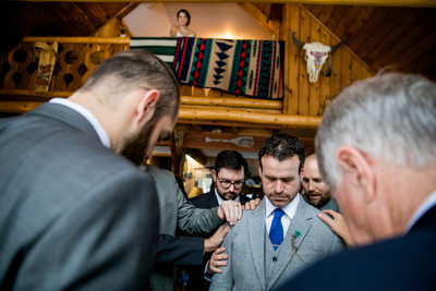 Groom Prayer While Bride Watches Elk Mountain Resort