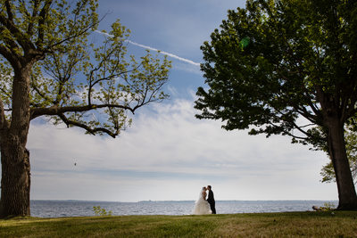 Lake Ontario Wedding Bride Groom Kiss Chaumont New York