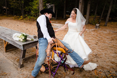Groom falls of a saddle as bride laughs at Hills Resort