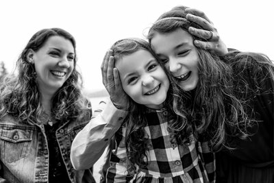 Sisters Face Smash Moment Coeur d'Alene Family Portrait