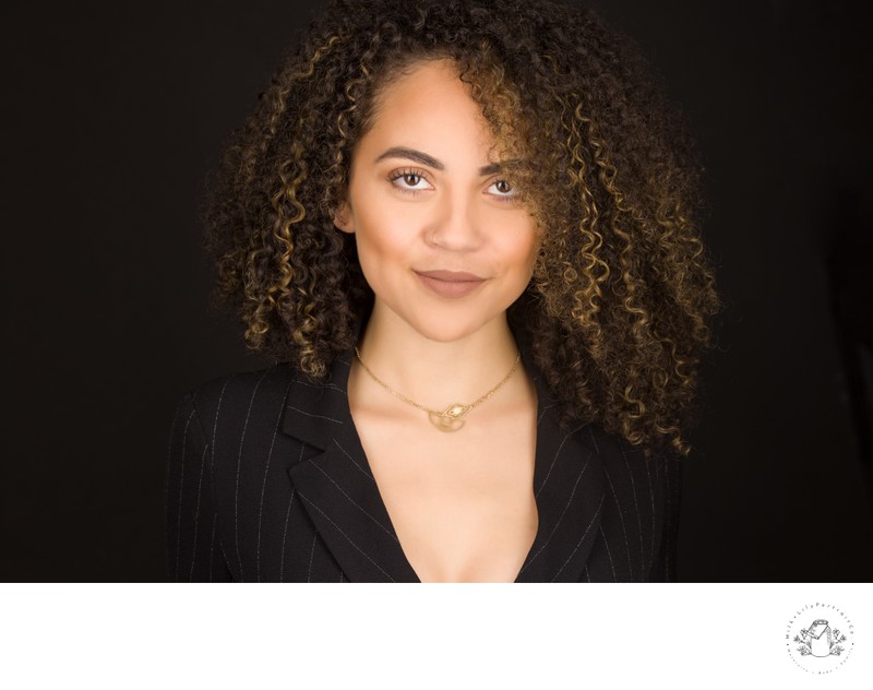 Professional headshot celebrating natural curls