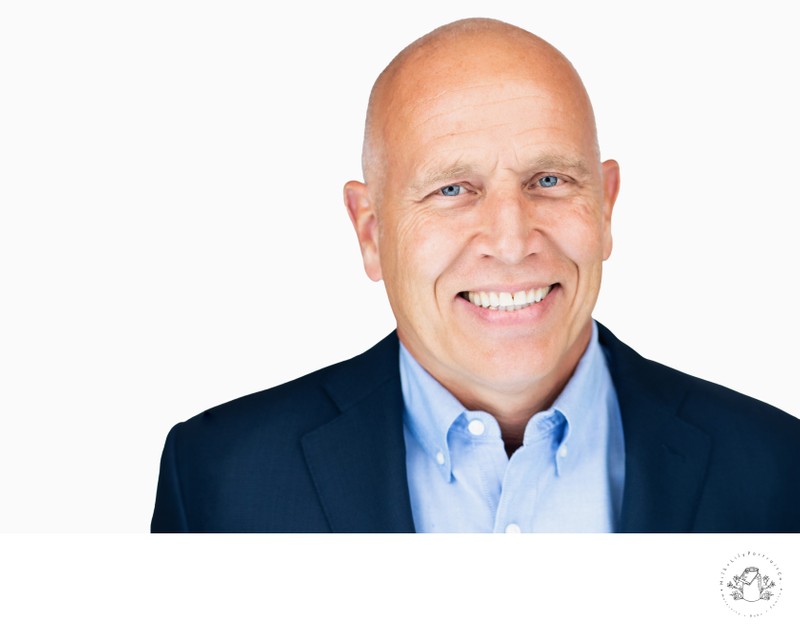 Corporate Headshot of a Bald Business Executive