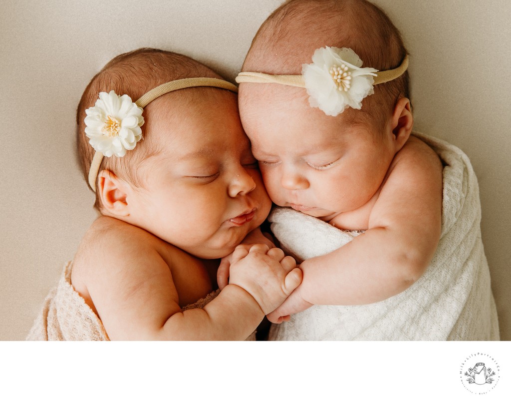 Newborn Twins Cuddling During a Studio Photo Shoot