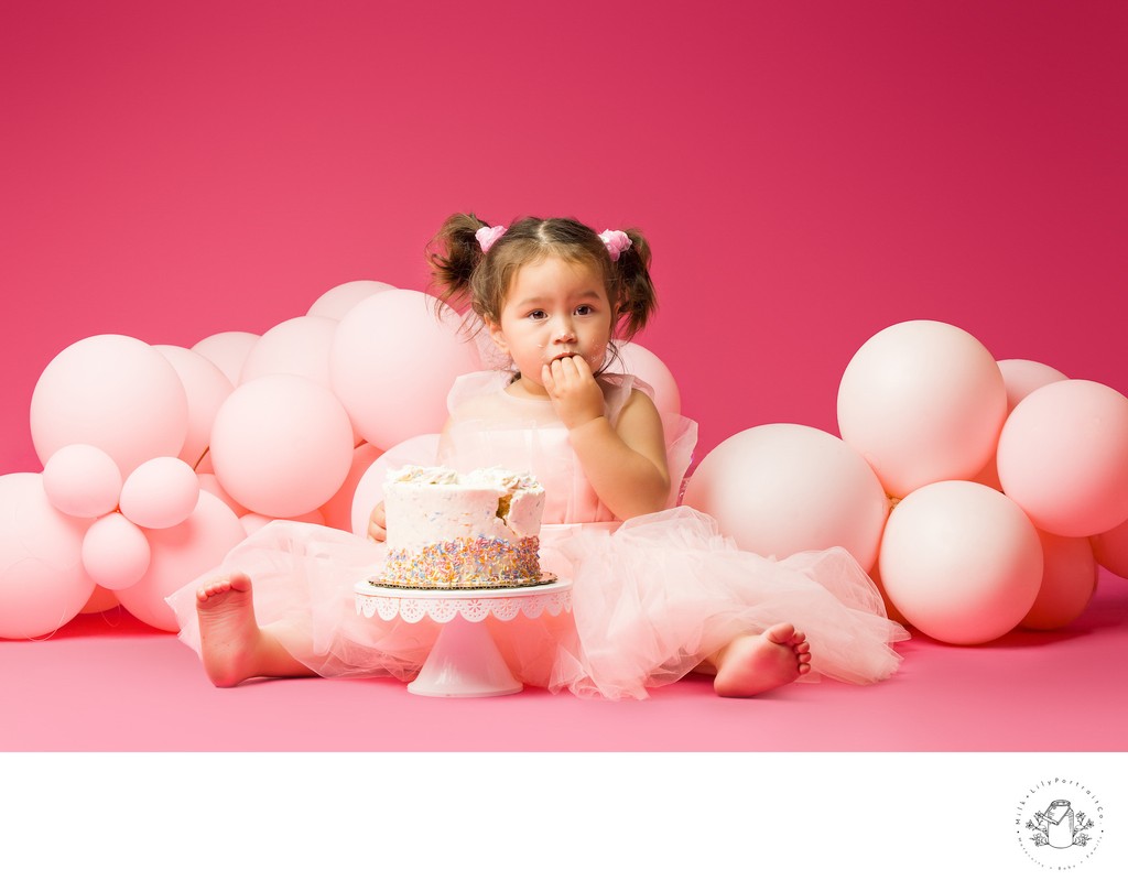 baby eating cake