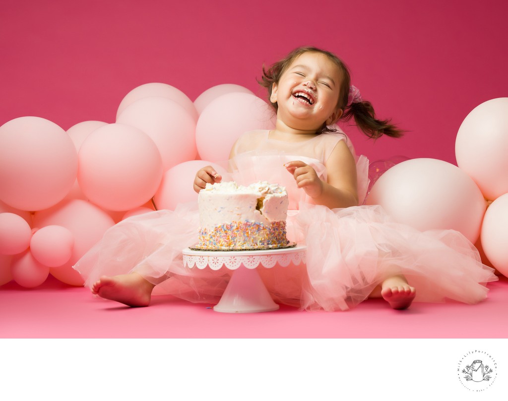 laughing birthday baby photo shoot