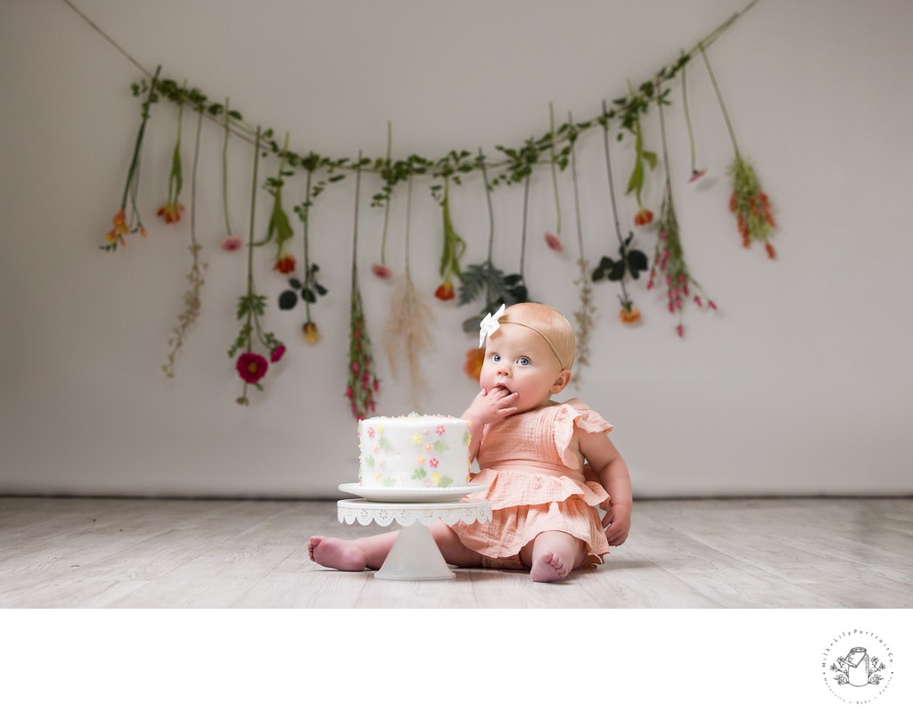 Sweet baby portrait with fresh wildflowers