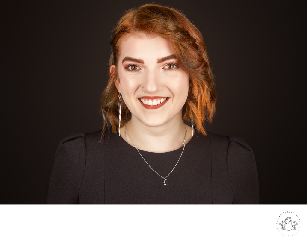 Redhead headshot on black backdrop