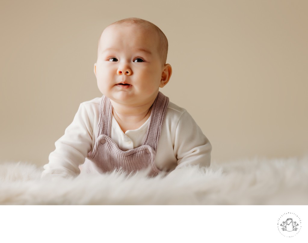 infant portrait session beige backdrop