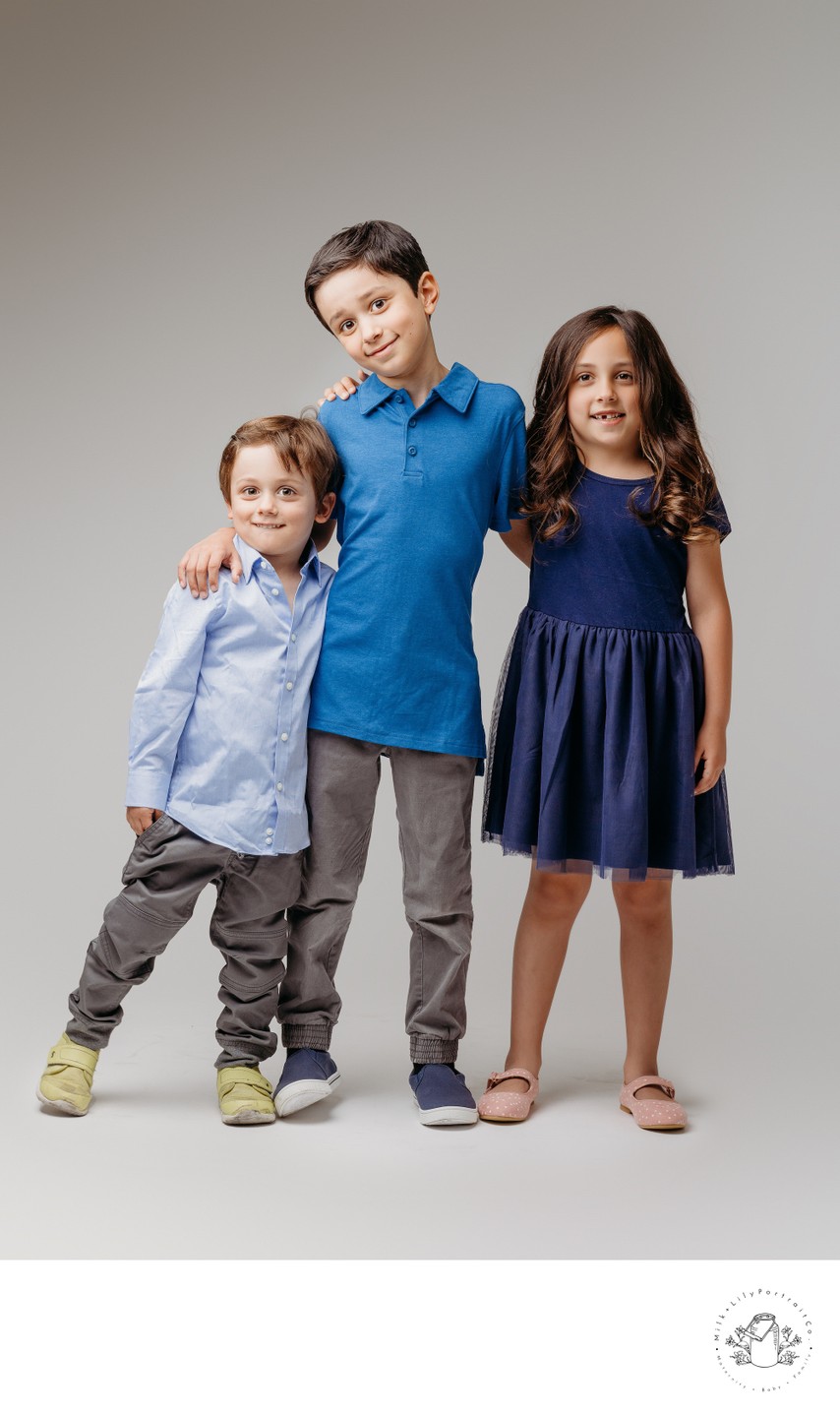 sibling portrait session wearing blue