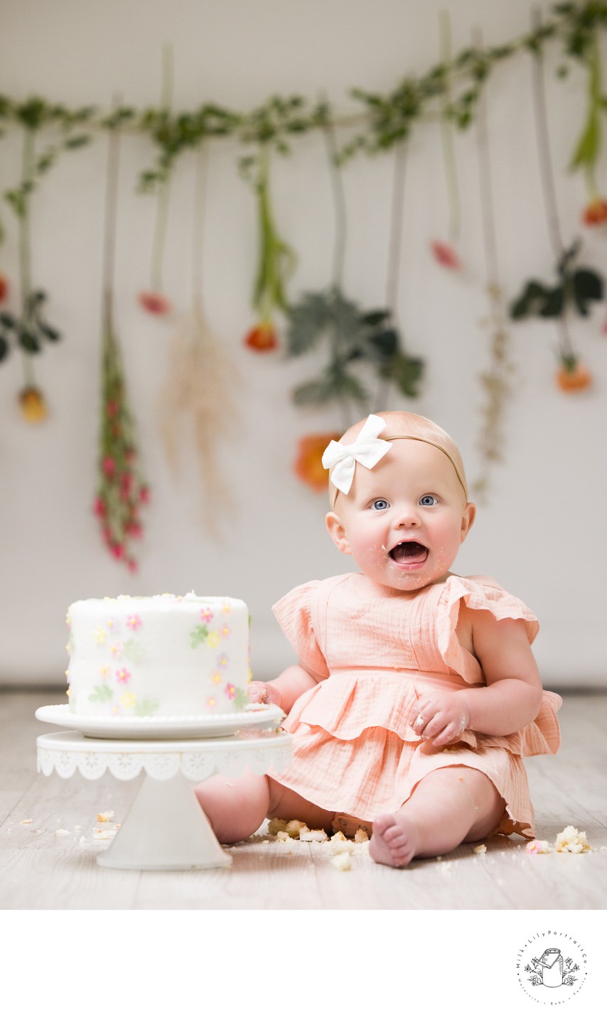 Tender baby portrait with fresh wildflowers