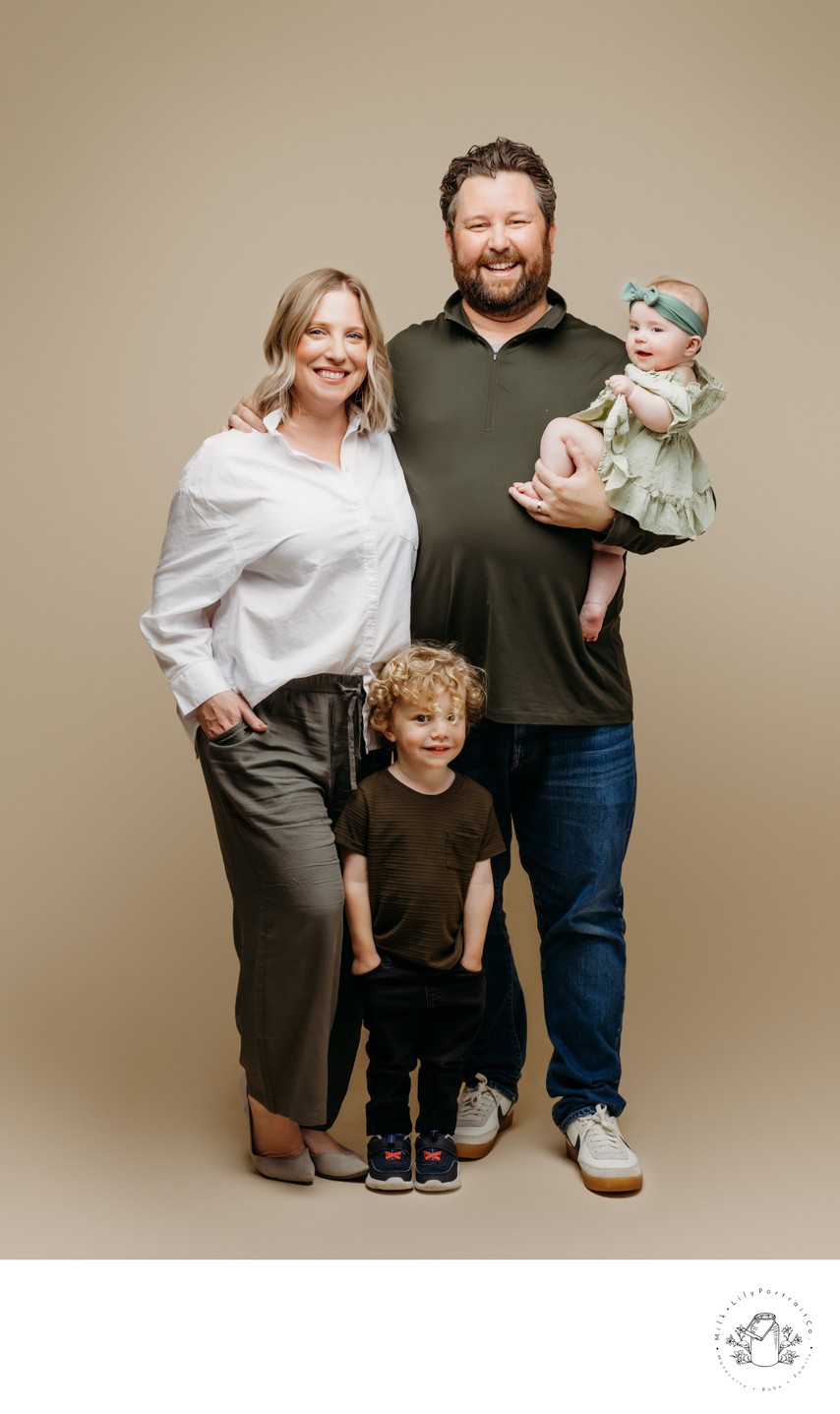 Fun family session on beige backdrop