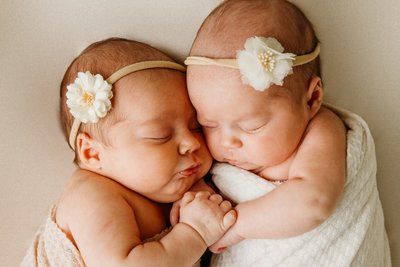 Newborn Twins Cuddling During a Studio Photo Shoot