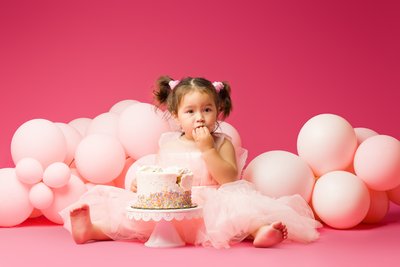 baby eating cake