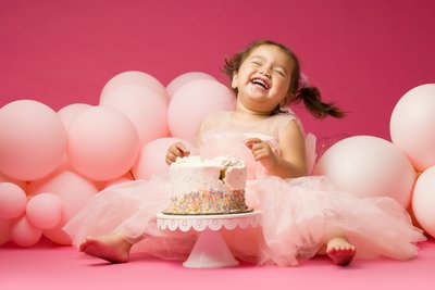 laughing birthday baby photo shoot