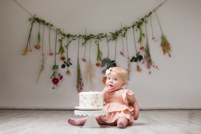 Sweet baby portrait with fresh wildflowers