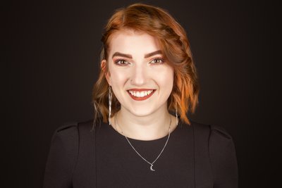 Redhead headshot on black backdrop