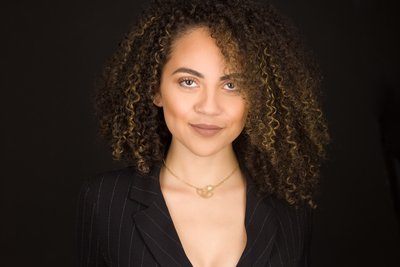 Professional headshot celebrating natural curls