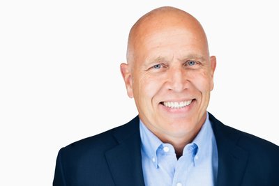 Corporate Headshot of a Bald Business Executive