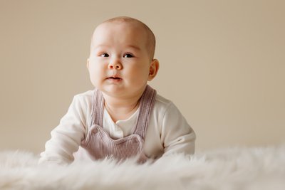 infant portrait session beige backdrop