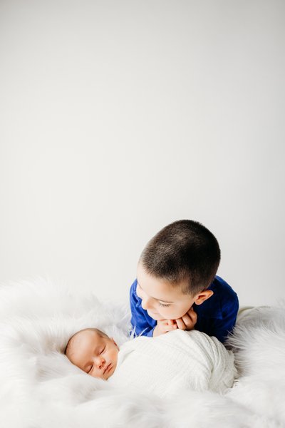 Sibling Harmony Celebrate with Newborn Portraits