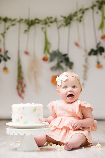 Tender baby portrait with fresh wildflowers