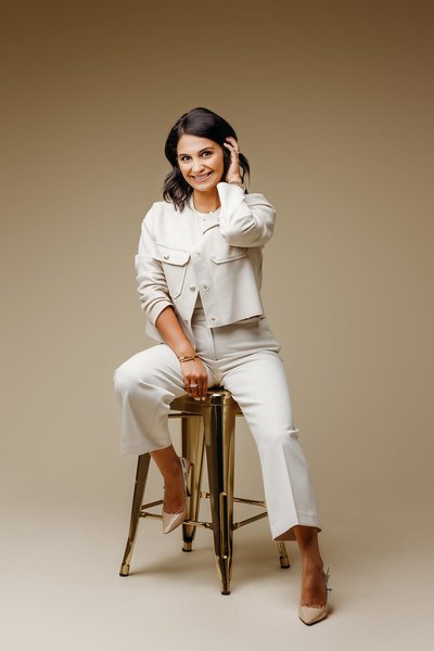 Cream backdrop gold stool headshot session