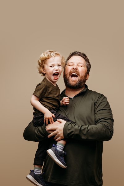 Fun and funny father son portrait