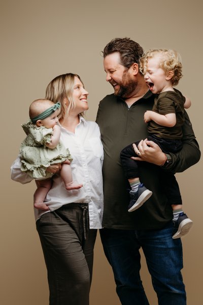 Laughing Family Portrait with Two Kids