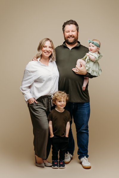 Fun family session on beige backdrop