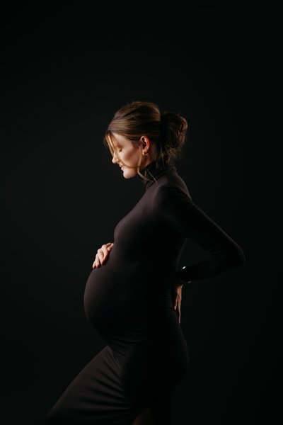 black backdrop maternity photo