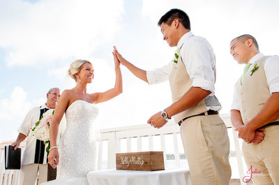 Bride and Groom high five at Ocean Key resort
