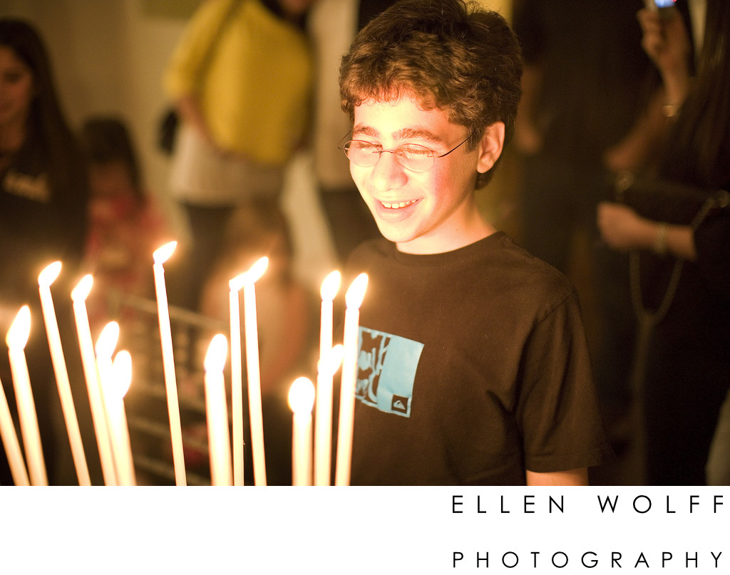 bar mitzvah portrait with candle light from the cake