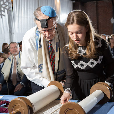 bat mitzvah and grandfather read together from the torah