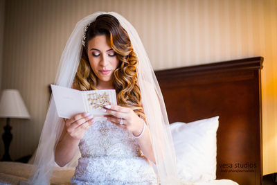 Bride reading a note from her future husband 