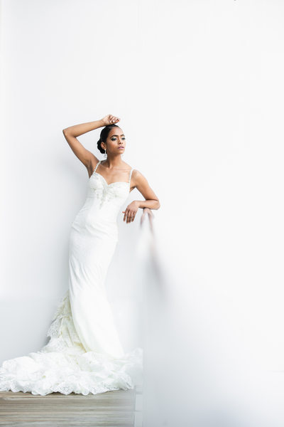 Bride posing elegantly in Winnie Couture gown