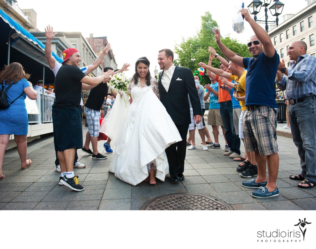 Newlyweds walk through impromptu congratulations from crowd in Old Montreal